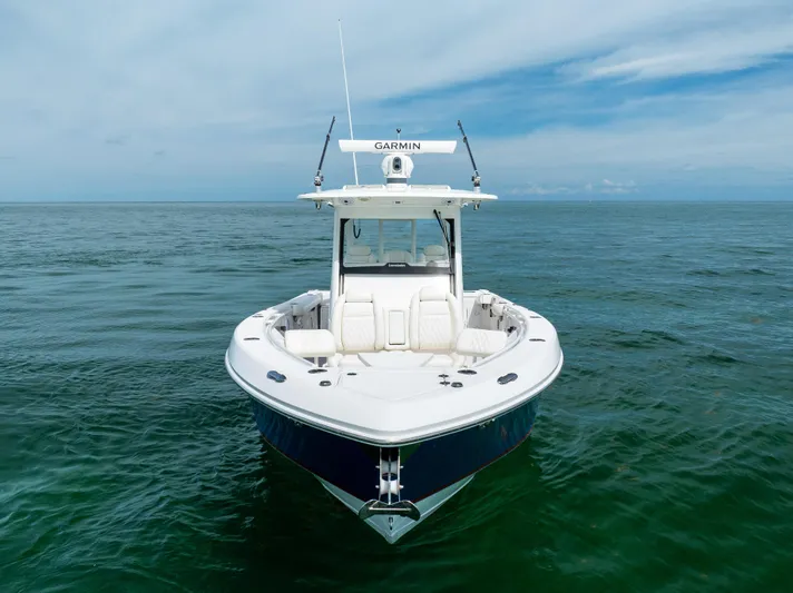  Yacht Photos Pics 2019 Everglades 335 Center Console boat on open water, front view.