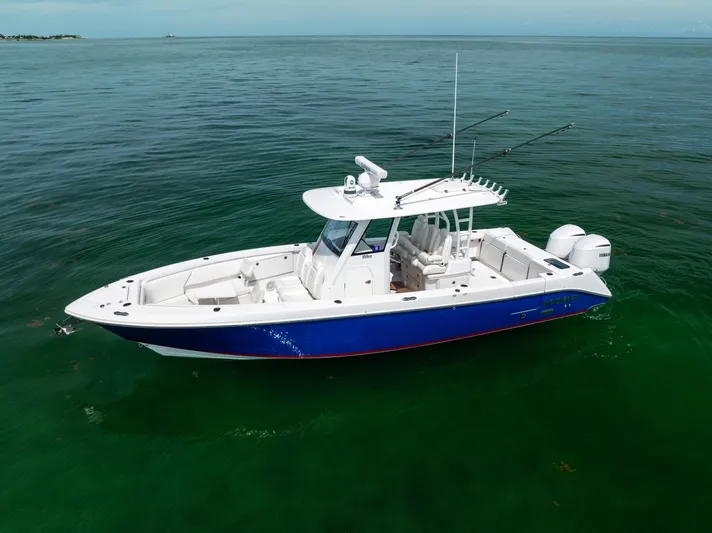  Yacht Photos Pics 2019 Everglades 335 Center Console boat on calm ocean waters.