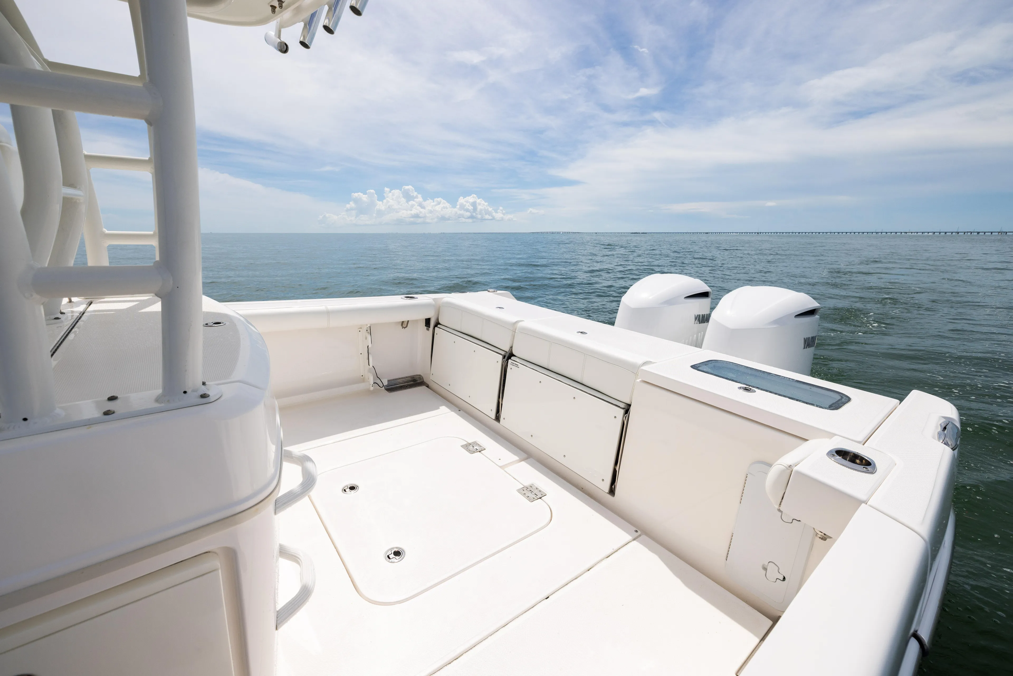  Yacht Photos Pics 2019 Everglades 335 Center Console boat on open water, featuring spacious deck and twin engines.