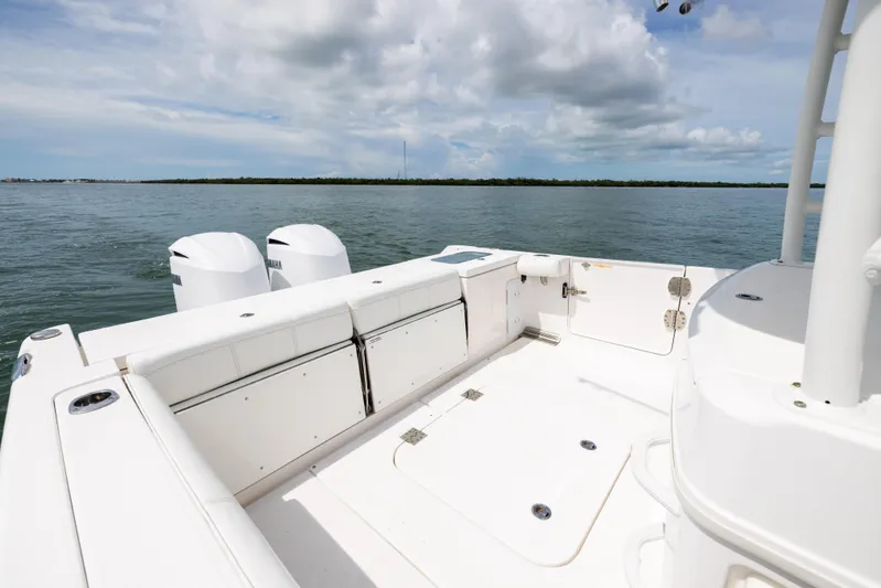  Yacht Photos Pics 2019 Everglades 335 Center Console boat interior with dual engines on calm water.