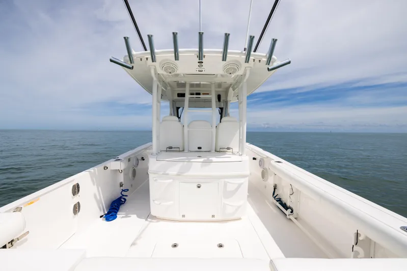 Yacht Photos Pics 2019 Everglades 335 Center Console boat on open water, showcasing spacious deck and seating.