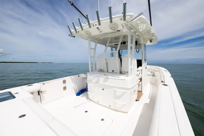  Yacht Photos Pics 2019 Everglades 335 Center Console boat on open water, showcasing spacious deck and seating.