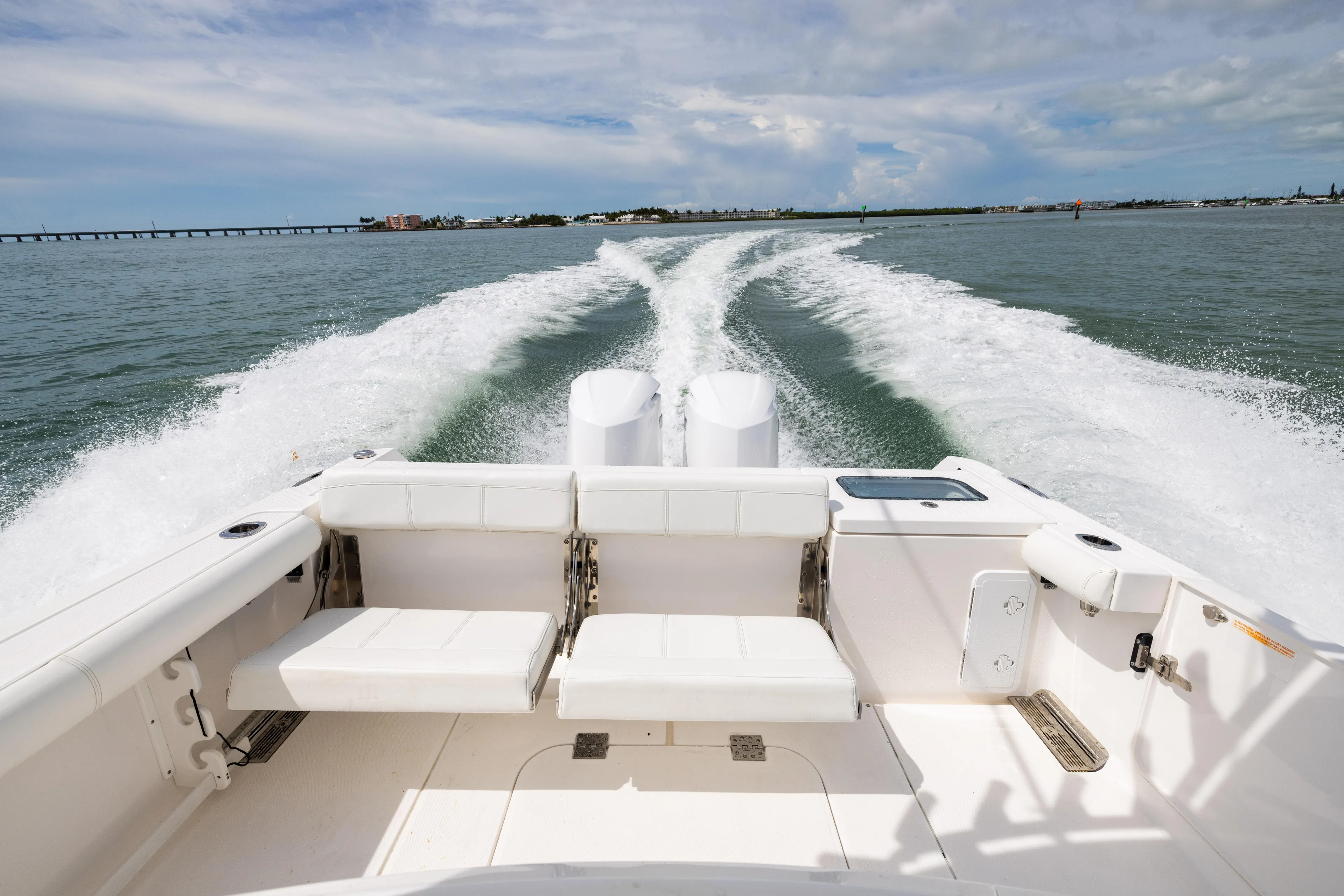  Yacht Photos Pics 2019 Everglades 335 Center Console boat cruising on open water, leaving a wake.
