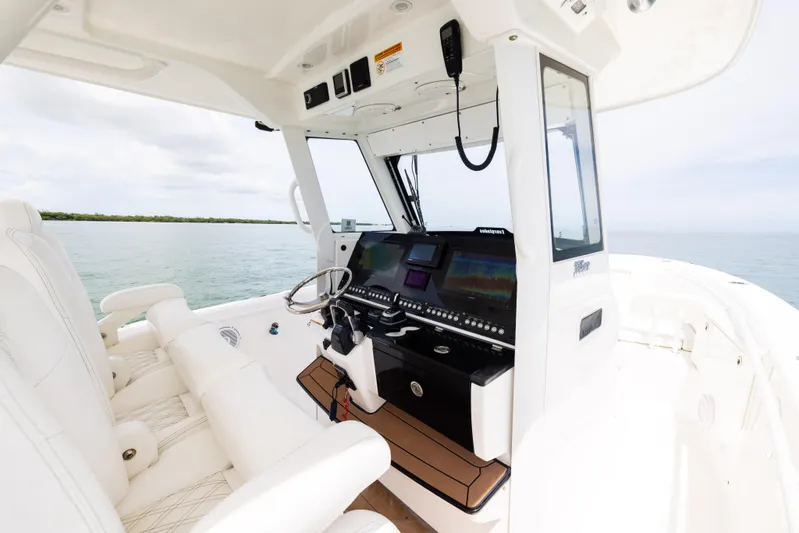  Yacht Photos Pics 2019 Everglades 335 Center Console boat interior with modern navigation system.