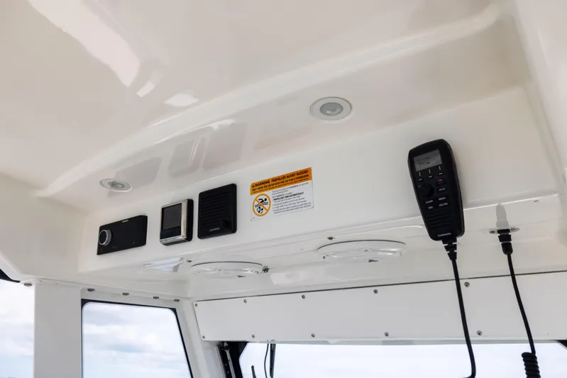  Yacht Photos Pics Interior electronics of 2019 Everglades 335 Center Console boat, featuring communication devices.