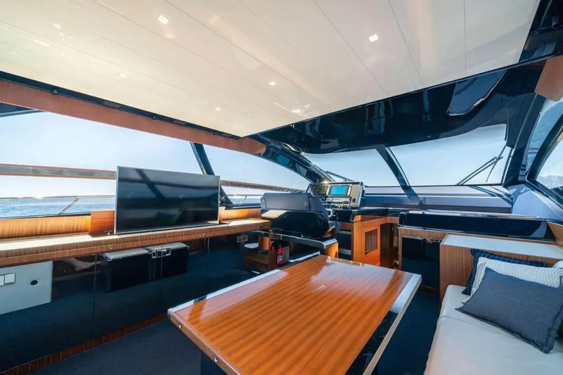  Yacht Photos Pics Luxurious interior of 2019 Riva 66 RIBELLE yacht with modern furnishings and panoramic windows.