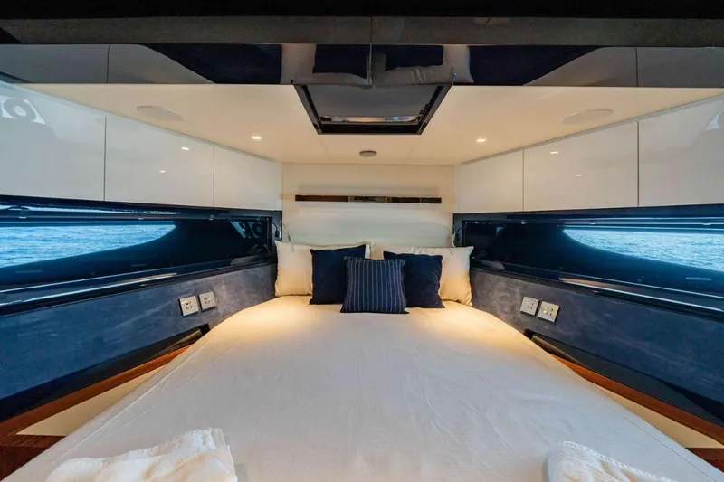  Yacht Photos Pics Luxurious interior cabin of 2019 Riva 66 RIBELLE yacht with elegant bedding.