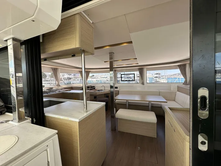 Gemini Yacht Photos Pics Luxurious interior of 2024 Lagoon 46 yacht with modern furnishings and ample natural light.
