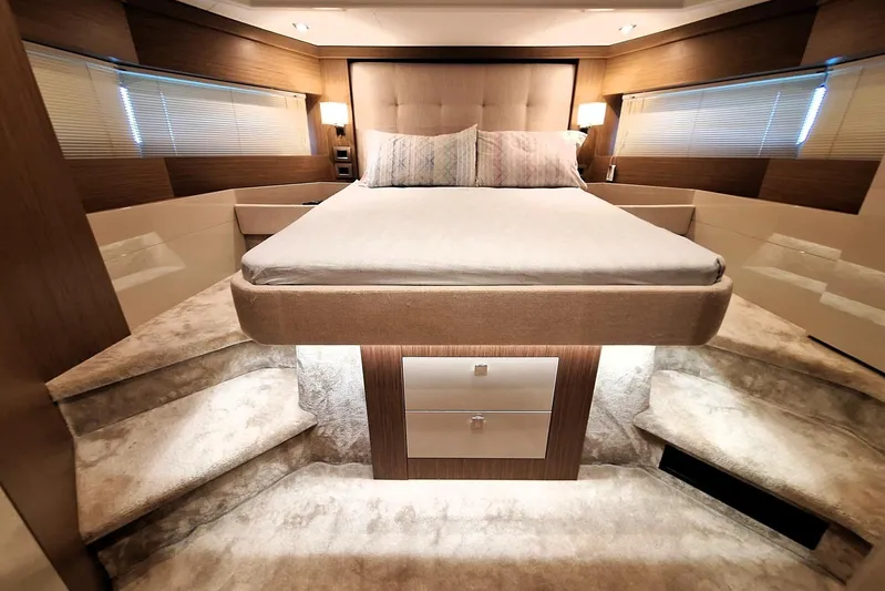  Yacht Photos Pics Luxurious bedroom interior of 2024 Cranchi T43 Eco Trawler with plush bedding and modern design.