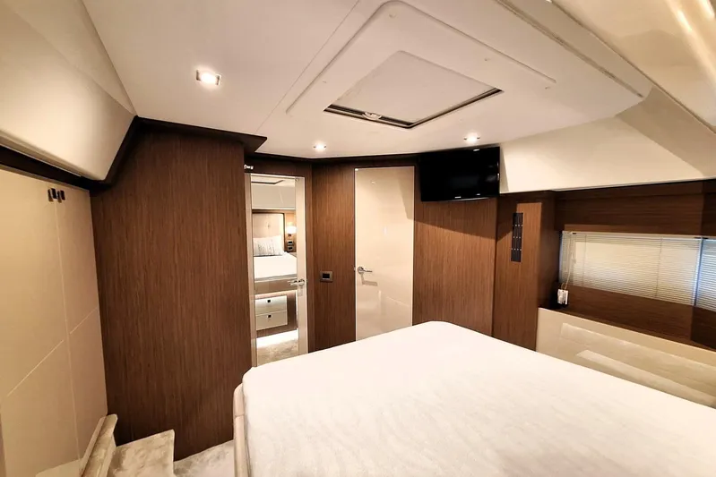  Yacht Photos Pics Luxurious interior of 2024 Cranchi T43 Eco Trawler, featuring modern wood paneling and elegant design.
