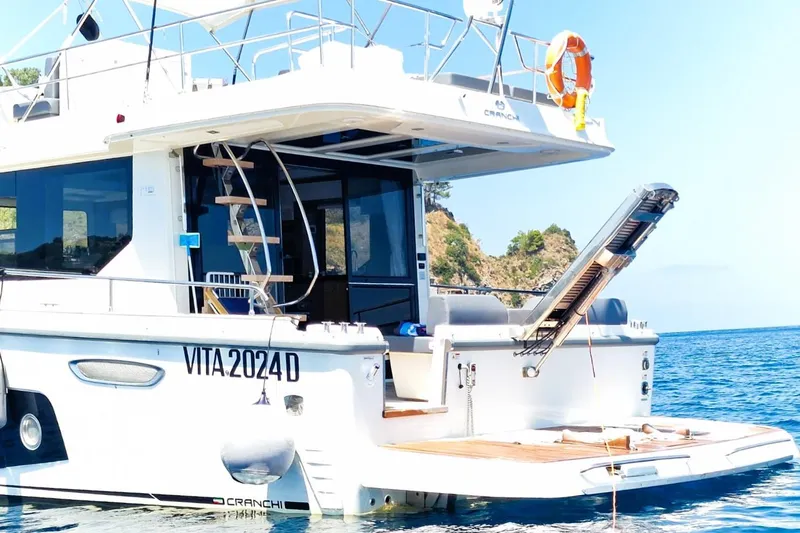  Yacht Photos Pics 2024 Cranchi T43 Eco Trawler yacht on serene blue waters.