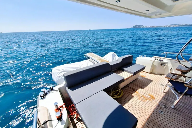  Yacht Photos Pics 2024 Cranchi T43 Eco Trawler deck with seating, overlooking serene ocean view.