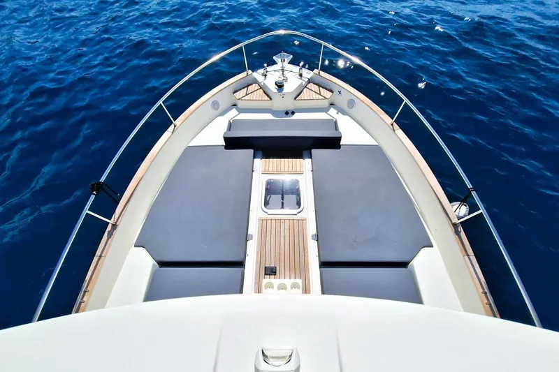  Yacht Photos Pics 2024 Cranchi T43 Eco Trawler bow view on open sea.