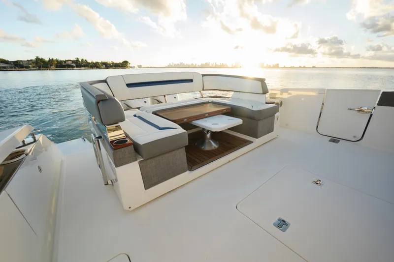  Yacht Photos Pics 2020 Tiara Yachts 43 LS luxury yacht deck with seating, ocean view, and sunset.
