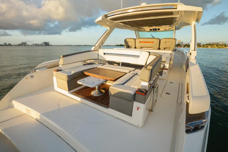  Yacht Photos Pics Luxurious 2020 Tiara Yachts 43 LS with elegant seating on calm waters.