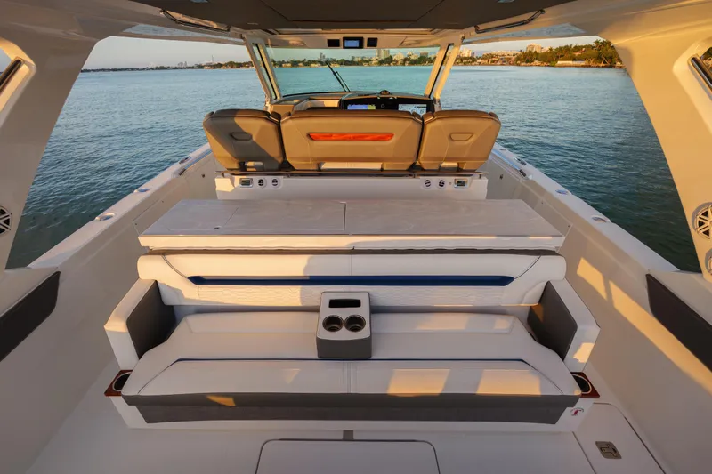  Yacht Photos Pics 2020 Tiara Yachts 43 LS luxury boat interior with seating, on calm water.