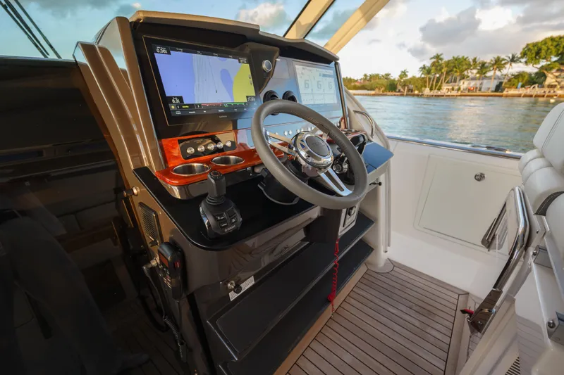  Yacht Photos Pics 2020 Tiara Yachts 43 LS helm with advanced navigation system and luxurious interior.