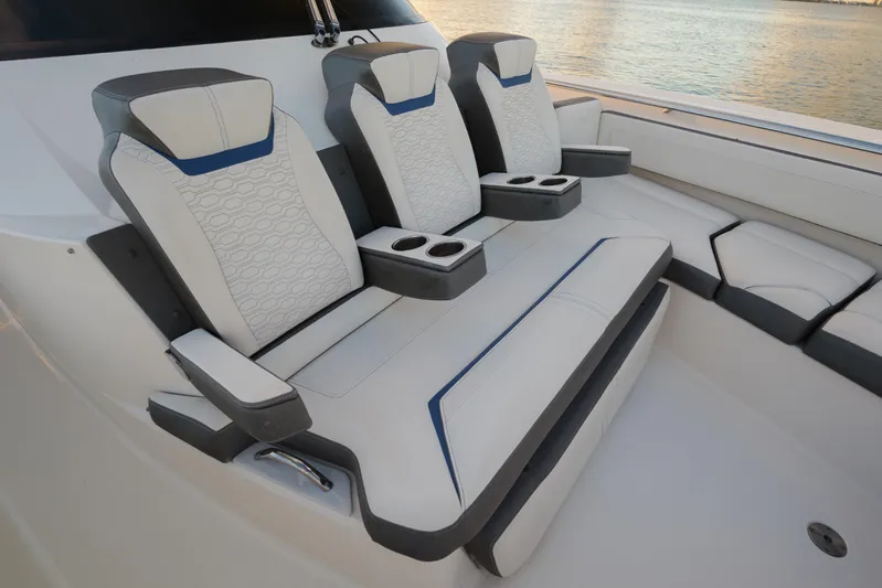  Yacht Photos Pics Luxurious seating on 2020 Tiara Yachts 43 LS, featuring elegant design and cup holders.