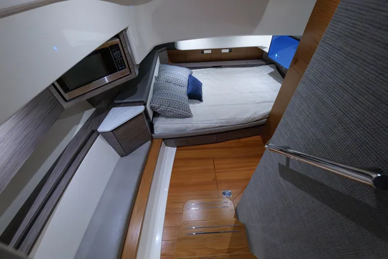  Yacht Photos Pics 2020 Tiara Yachts 43 LS cabin interior with bed, microwave, and modern design.