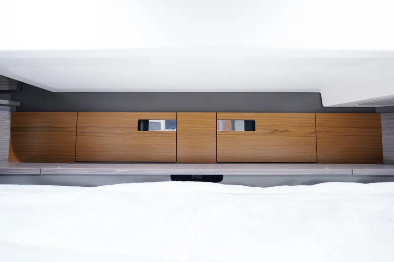  Yacht Photos Pics Interior view of 2020 Tiara Yachts 43 LS, featuring sleek wooden cabinetry.