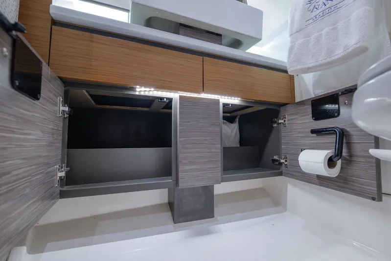 Yacht Photos Pics Modern bathroom cabinet in 2020 Tiara Yachts 43 LS, featuring open storage and sleek design.