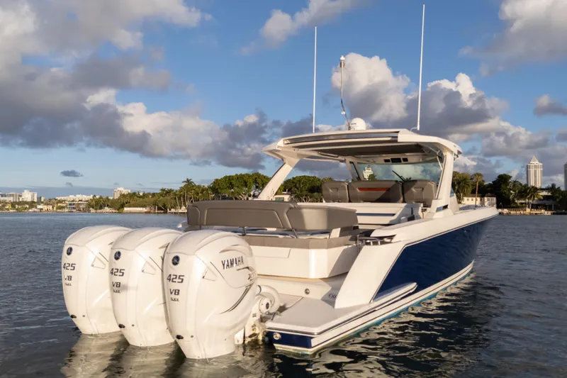  Yacht Photos Pics 2020 Tiara Yachts 43 LS with triple Yamaha 425 V8 engines on calm water.