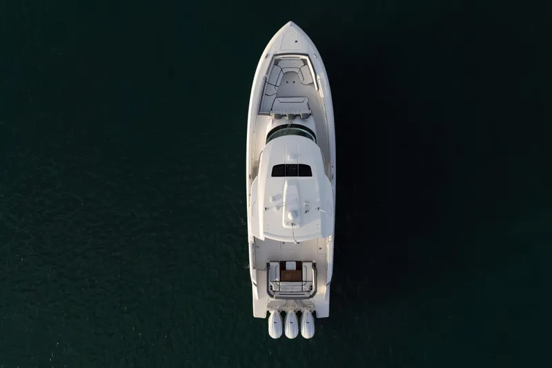  Yacht Photos Pics Aerial view of 2020 Tiara Yachts 43 LS on dark water.