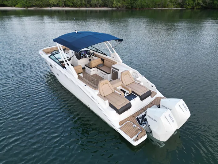  Yacht Photos Pics 2021 Sea Ray SDX 290 Outboard boat on calm water, featuring spacious seating and dual engines.