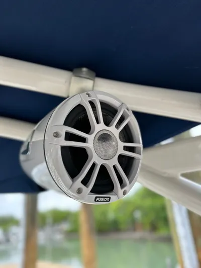  Yacht Photos Pics Fusion marine speaker on 2021 Sea Ray SDX 290 Outboard boat, mounted under blue canopy.