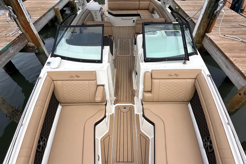  Yacht Photos Pics 2021 Sea Ray SDX 290 Outboard boat interior with tan seating and wood accents.