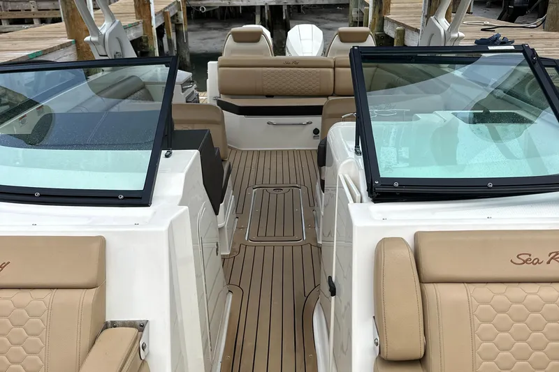  Yacht Photos Pics 2021 Sea Ray SDX 290 Outboard boat interior with tan seating and glass windshields.