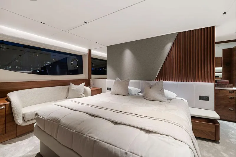 S72531 Yacht Photos Pics Luxurious bedroom interior of 2025 Princess S72 yacht with modern design and elegant furnishings.