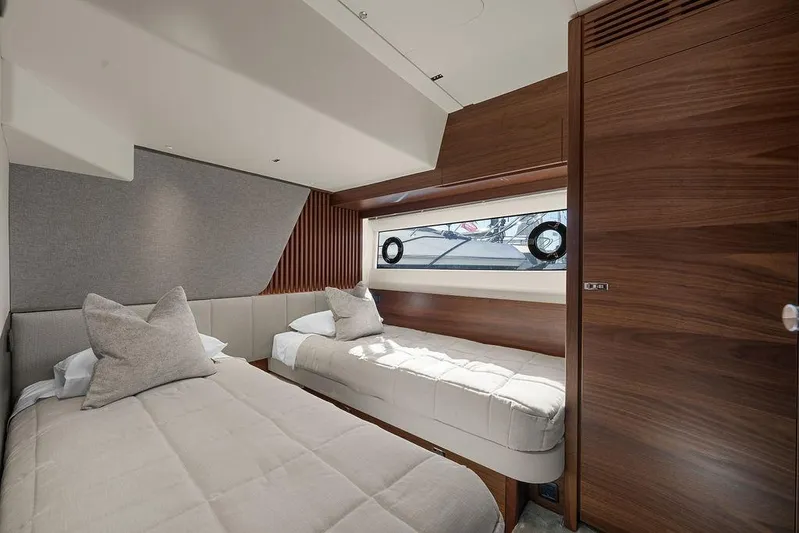 S72531 Yacht Photos Pics Luxurious 2025 Princess S72 yacht cabin with twin beds and elegant wood paneling.