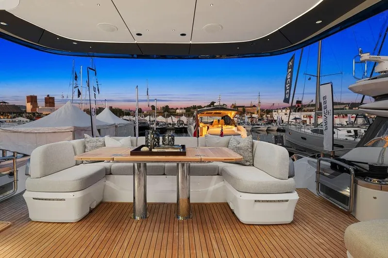 S72531 Yacht Photos Pics Luxurious 2025 Princess S72 yacht deck with elegant seating and marina view.
