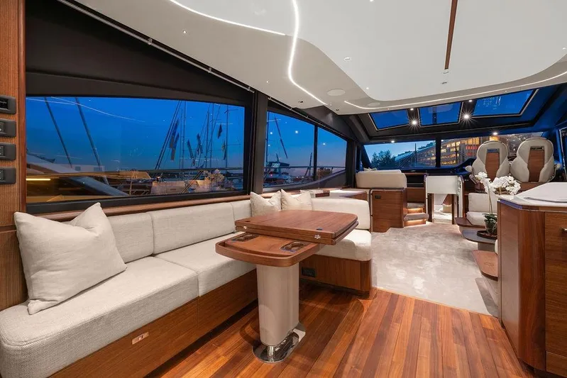 S72531 Yacht Photos Pics Luxurious interior of 2025 Princess S72 yacht with elegant wood and plush seating.