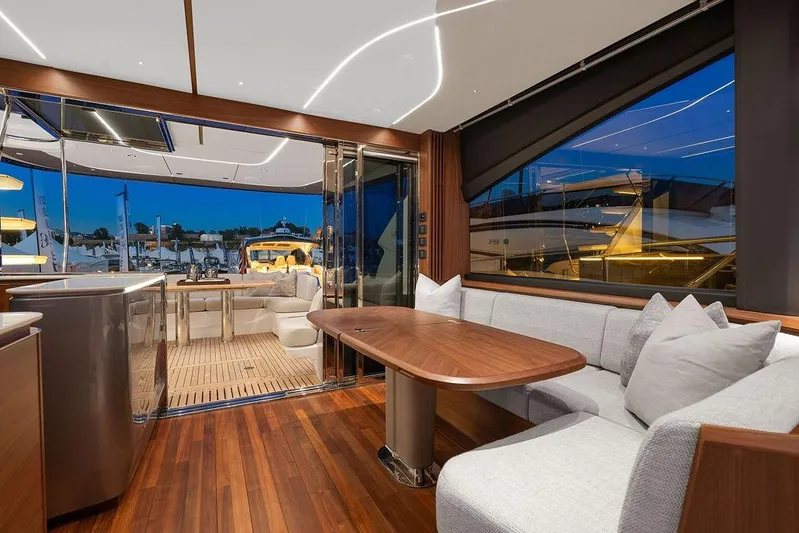 S72531 Yacht Photos Pics Luxurious interior of 2025 Princess S72 yacht with elegant seating and wooden finishes.