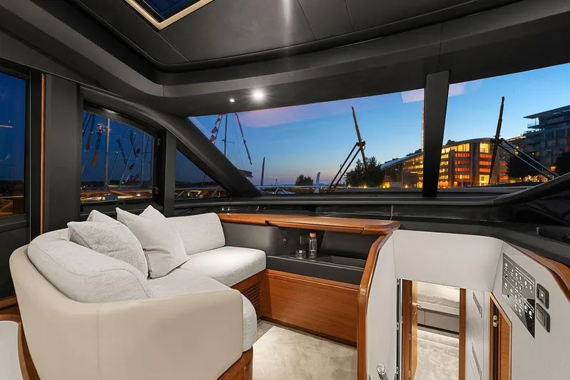 S72531 Yacht Photos Pics Luxurious interior of 2025 Princess S72 yacht with panoramic windows at sunset.