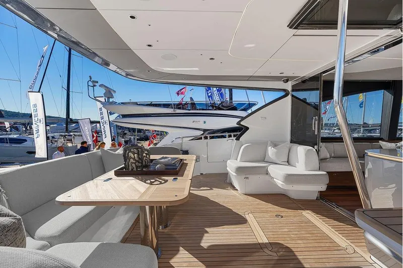S72531 Yacht Photos Pics Luxurious 2025 Princess S72 yacht interior with elegant seating and wooden flooring.