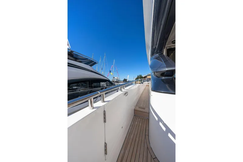 S72531 Yacht Photos Pics Side view of 2025 Princess S72 yacht with sleek design and wooden deck.