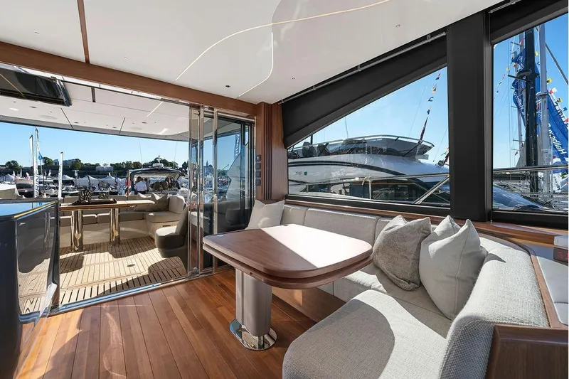 S72531 Yacht Photos Pics Luxurious interior of 2025 Princess S72 yacht with elegant seating and wooden flooring.