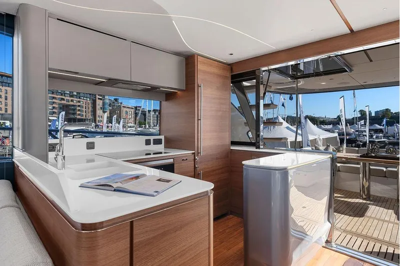 S72531 Yacht Photos Pics Luxurious interior of 2025 Princess S72 yacht with modern kitchen and marina view.