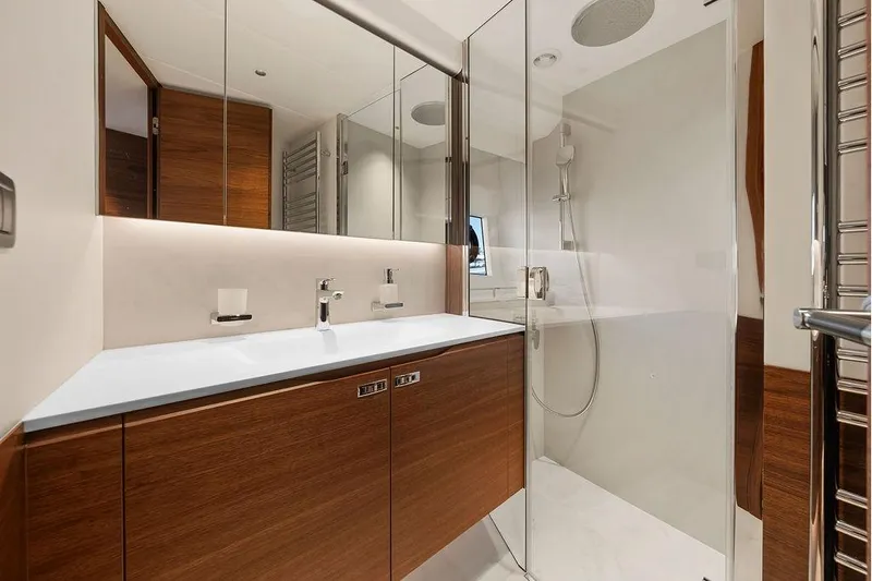 S72531 Yacht Photos Pics Luxurious bathroom in 2025 Princess S72 yacht with modern fixtures and wooden cabinetry.