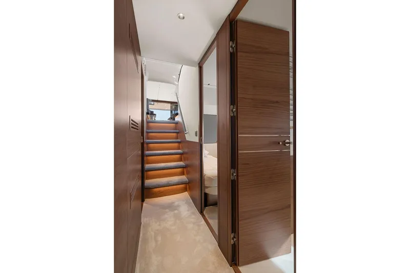 S72531 Yacht Photos Pics Interior of 2025 Princess S72 yacht with wooden stairs and modern design.