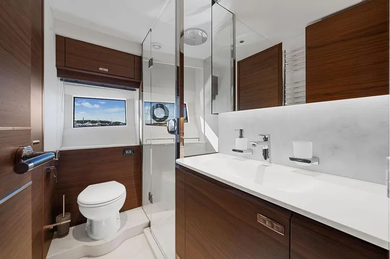 S72531 Yacht Photos Pics Luxurious 2025 Princess S72 yacht bathroom with modern fixtures and wood accents.