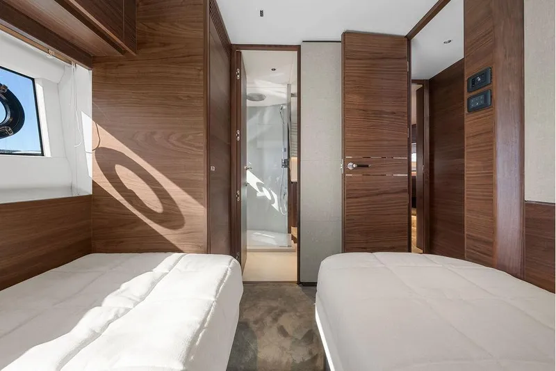 S72531 Yacht Photos Pics Luxurious 2025 Princess S72 yacht cabin with twin beds and modern wood finish.