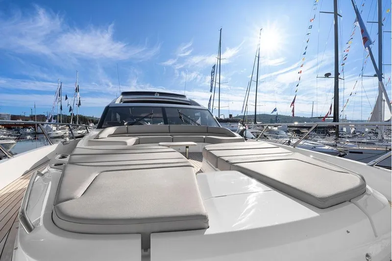 S72531 Yacht Photos Pics Luxurious 2025 Princess S72 yacht with sunbeds, docked under a clear blue sky.