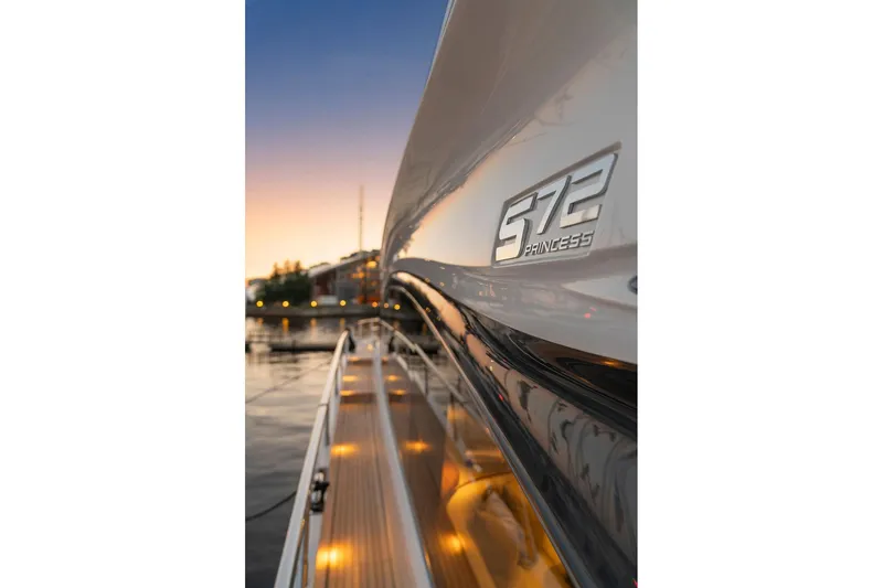 S72531 Yacht Photos Pics 2025 Princess S72 yacht at sunset, showcasing sleek design and illuminated deck.