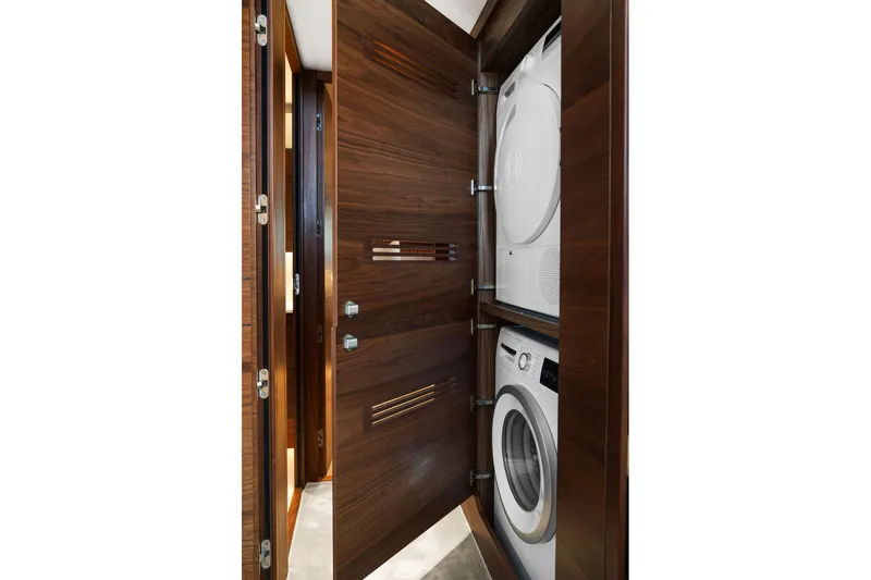 S72531 Yacht Photos Pics Laundry area with stacked washer and dryer in 2025 Princess S72 yacht.