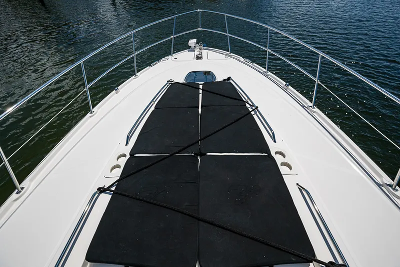  Yacht Photos Pics 2014 Sea Ray 470 Sundancer yacht deck with sun pads on water.