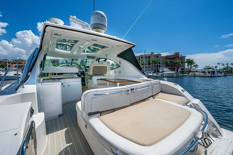  Yacht Photos Pics 2014 Sea Ray 470 Sundancer yacht docked at marina, featuring spacious deck and luxurious seating.